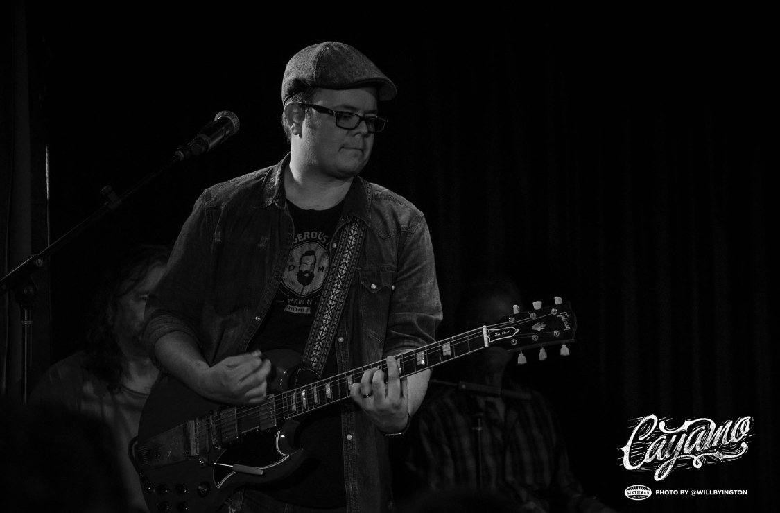 Patrick Blanchard performing on stage at Cayamo